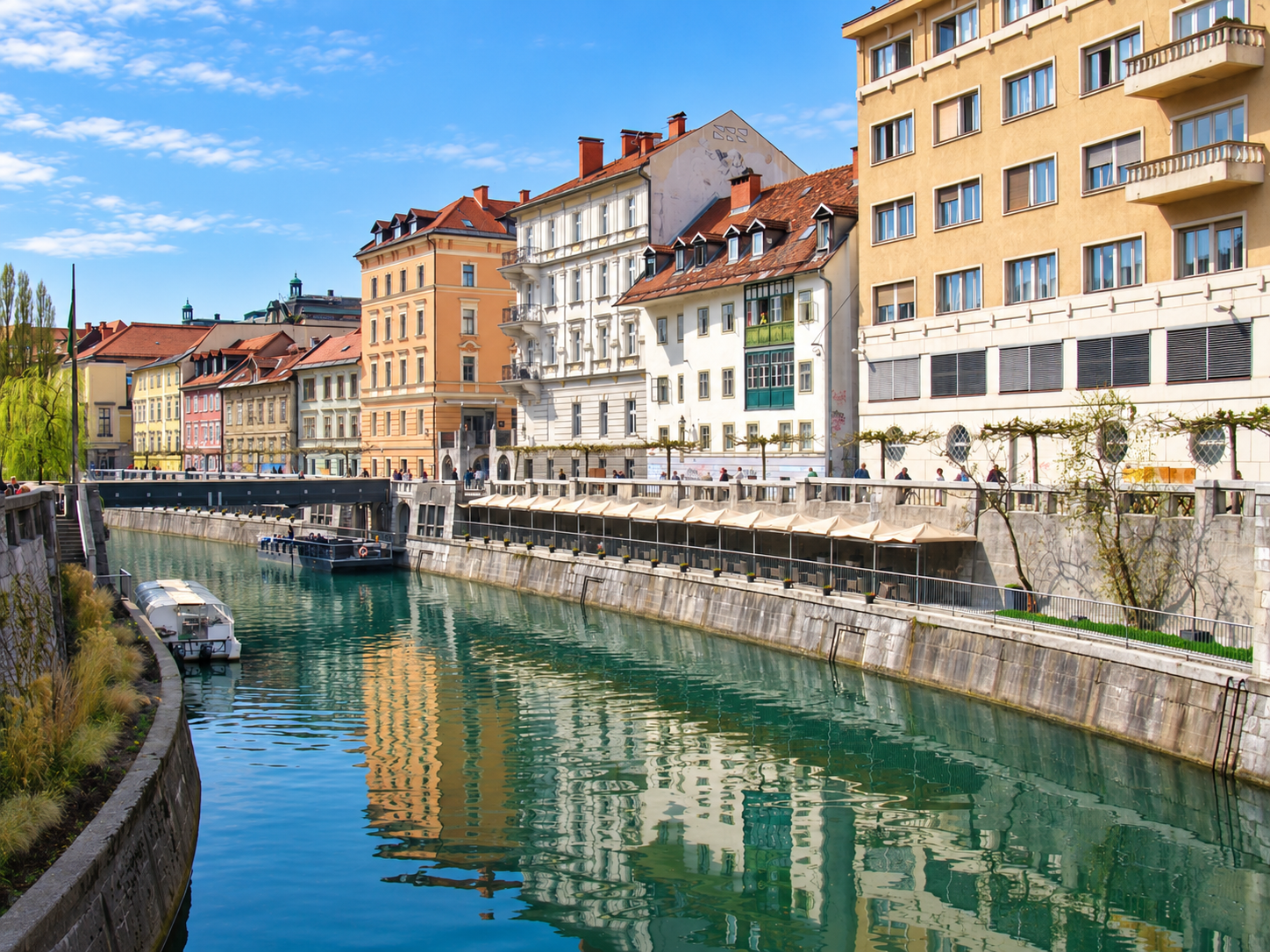 Colourful Old Town buildings and terraces beside the Ljubljanica